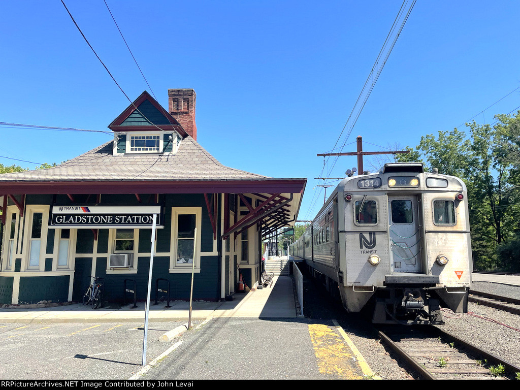 NJT Train # 421, after having arrived from Hoboken Terminal, with the Former Lackawanna Station building building 